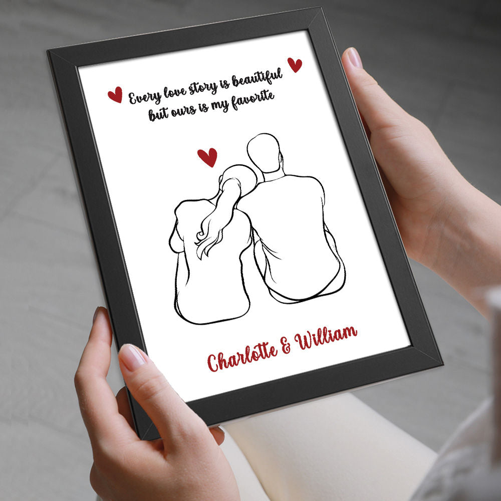 Personalised Love Story Print for Him and Her in black frame being held