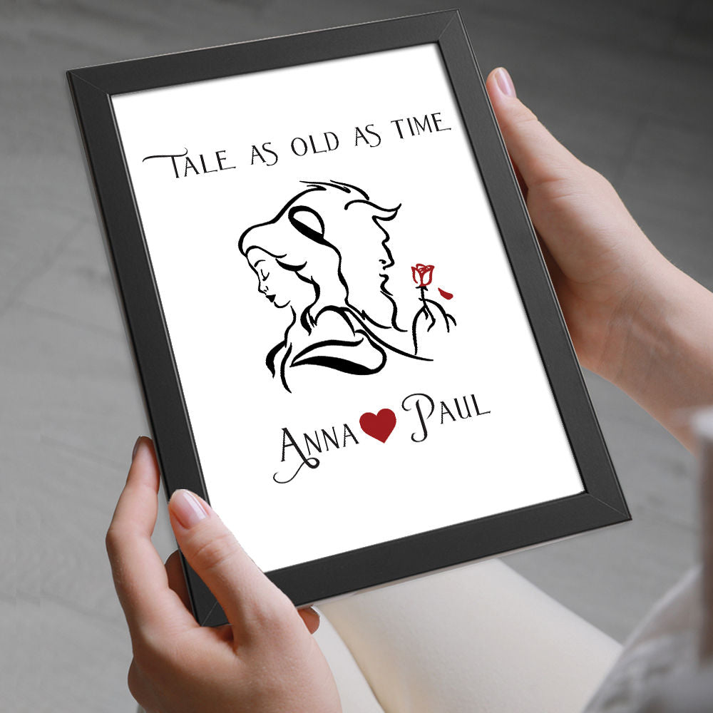 Personalised Beauty And The Beast Gift Print in black frame being held