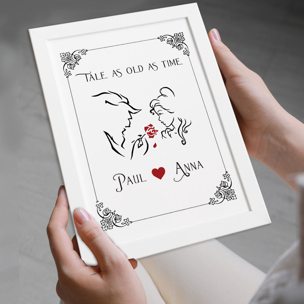 Personalised Beauty And The Beast Classical Print For Him And Her in white frame being held