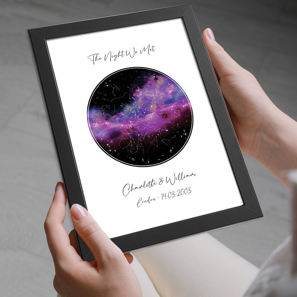 Personalised Star Map Night Sky Print With Black And Pink Background in black frame being held